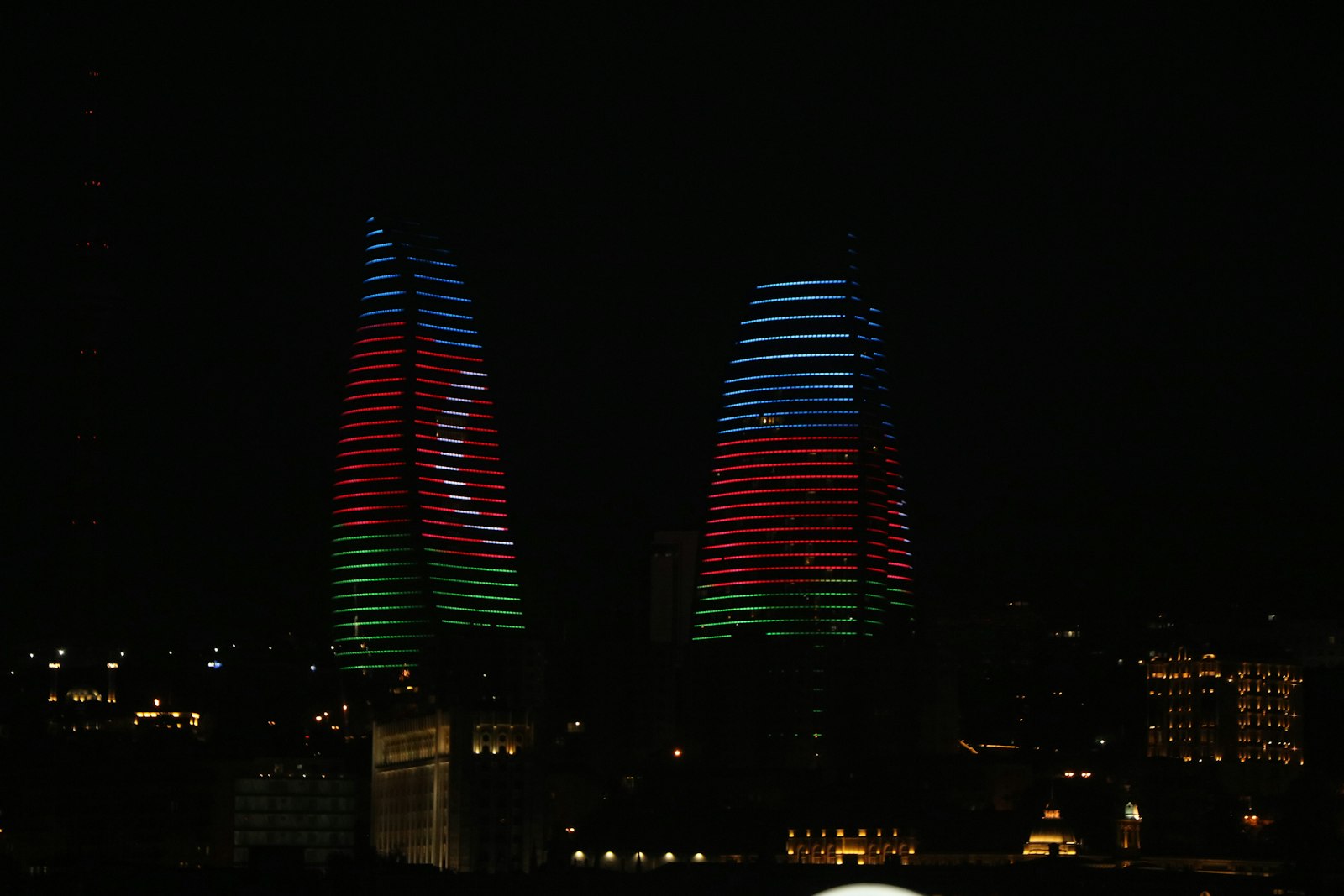 The Flame Towers lit up at night in Baku