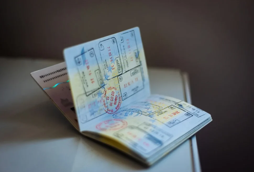 Open passport with travel stamps